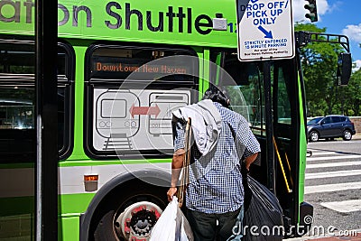Minority Man Boarding Bus Editorial Stock Photo