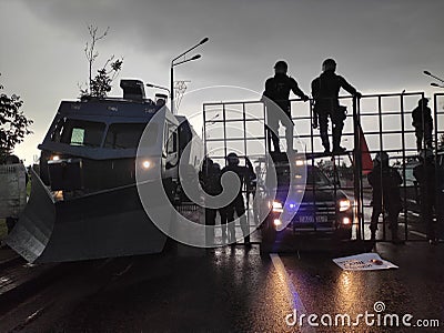 Minsk / Belarus - August 30 2020: Riot police blocking the road for protesters with water cannons, cages and shields Editorial Stock Photo