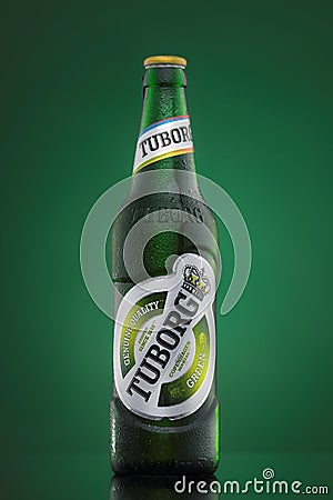 MINSK, BELARUS-AUGUST 23, 2016. Tuborg glass bottle beer on green background. Editorial Stock Photo