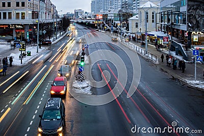 Evening traffic on the street. Lights of passing cars. Long exposure. Traffic lights Editorial Stock Photo