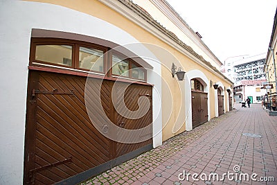 MINSK, BELARUS, JANUARY 3, 2019, Old Town. Buildings with large wooden gates. Pedestrian street Editorial Stock Photo