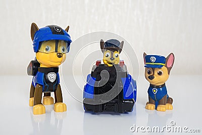 Minsk, Belarus - January 9, 2022: Paw patrol team. Miniatures of hero Chase with blue police truck Editorial Stock Photo