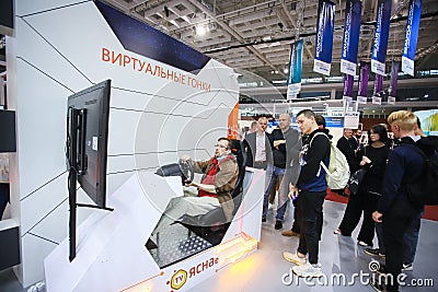 Minsk. Belarus - 05.31.2021 - Man plays the video game at the Tibo exhibition in Minsk, Belarus. Editorial Stock Photo