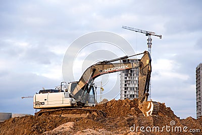 Excavator Hidromek HMK 220 LC working at construction site. Construction machinery for excavation, Editorial Stock Photo