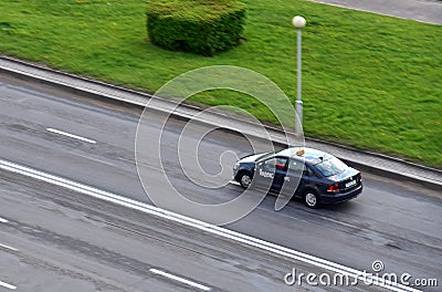 Aerial view on Yandex Taxi passenger car rides on the wet road. Small roughness sharpness, possible Editorial Stock Photo