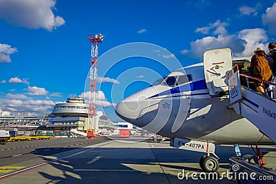 MINSK, BELARUS - MAY 01 2018: Outdoor view of unidentiifed people boarding the tupolev Tu-154 EW-85741 Belavia Airlines Editorial Stock Photo