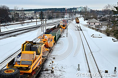 Transportation of dump trucks Belaz by rail. Editorial Stock Photo