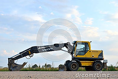 Volvo EW160B wheeled excavator at a construction site Editorial Stock Photo