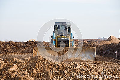 Track-type bulldozer SHANTUI SD16 at construction site Editorial Stock Photo