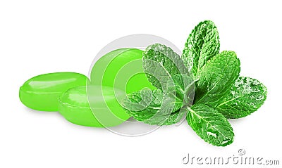 Mint hard candies and green leaves on white background Stock Photo