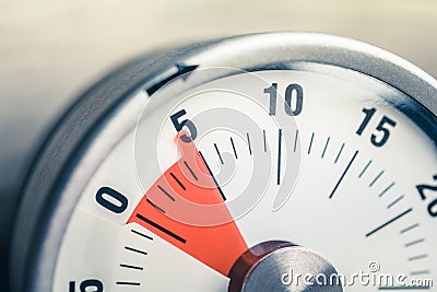 5 Minutes - Macro Of An Analog Timer On A Wooden Floor Stock Photo