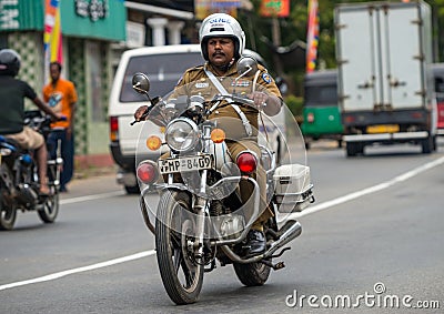 MIRISSA, SRI LANKA - January 01, 2017: Policemen riding a motor Editorial Stock Photo