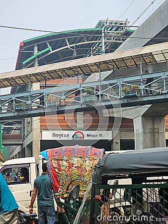 Mirpur, Dhaka, Bangladesh - 03.20.2023: Mirpur 10 Bus stand with the newly built metro rail station on the background. Dhaka city Editorial Stock Photo