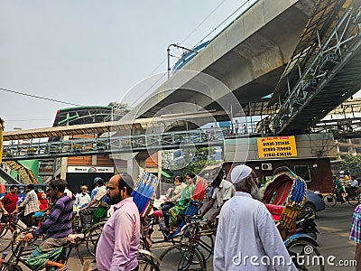 Mirpur, Dhaka, Bangladesh - 03.20.2023: Busy streets and traffic in the Road of Mirpur 10, Dhaka. Rickshaws and people crossing Editorial Stock Photo