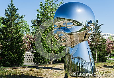 Mirror art object by sculptor Ken Kelleher Inner Child. Big baby heads with smiling faces in Public landscape city park Krasnodar Editorial Stock Photo