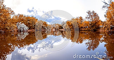 Mirror panorama of a small lake. trees on the shore. fall Stock Photo