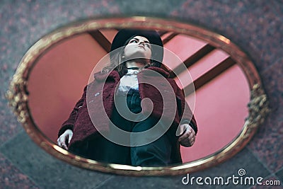 Mirror reflection creative girl portrait. Red colors. Artistic mood Stock Photo