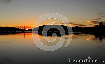 Mirror Reflections, Dusk at Big Bear Lake, California. Stock Photo