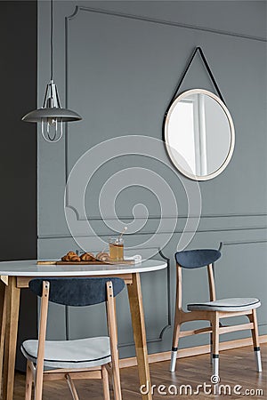 Mirror in simple dining room Stock Photo