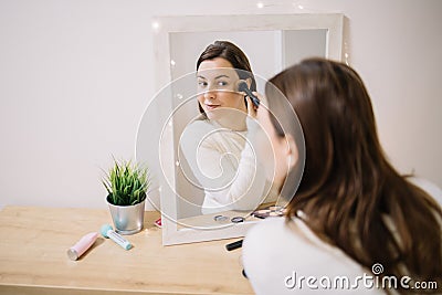 Mirrored image of a girl blushing her cheekbone Stock Photo