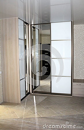 Mirrored sliding door wardrobes. Stock Photo