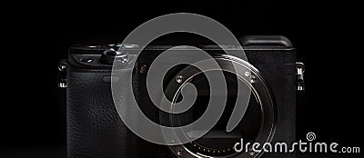 Mirrorless camera body on black background Stock Photo