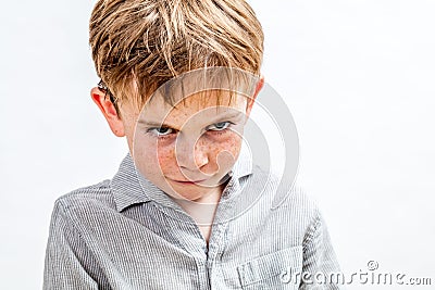 Mischievous bully child expressing revenge, retaliation or attitude problem, isolated Stock Photo