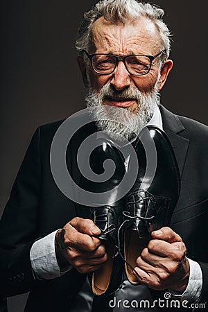 Miserable old aged bankrupt businessman asking not to deprive him of the last. Stock Photo