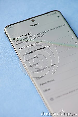 Misleading Ad report in facebook Stock Photo