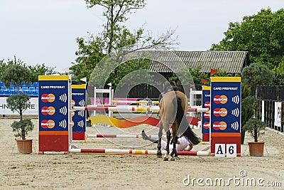 Equitation contest, horse refusing to jump over an obstacle Editorial Stock Photo