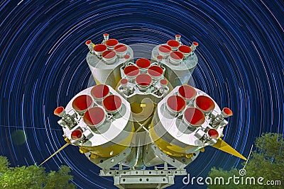 Missile engines of the first and second steps of the Soyuz rocket. Startrails background. Editorial Stock Photo