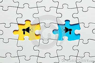 Missing puzzle pieces with megaphone icons. Communication, discussion, chatting, conversation, argument or negotiation Stock Photo