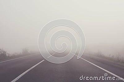 Mist on the road. Soft focus. Toned Stock Photo
