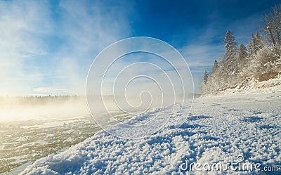 Mist rools off the North Saskatchewan river on a very cols winters morning Stock Photo