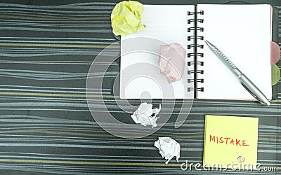 Mistake written on sticky notes. Learning, wrong, blooper, error, regret sayings background. Fault, defect, careless, lesson Stock Photo