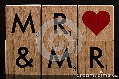 Mister and Mister Wooden Block TIles Stock Photo