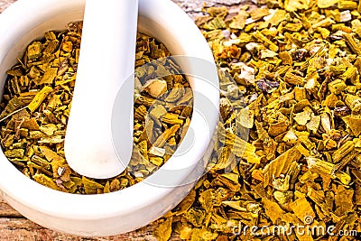 Mistletoe, medicinal herb dried with mortar Stock Photo