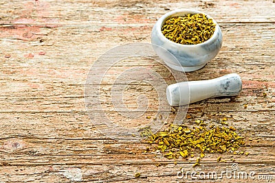 Mistletoe, medicinal herb dried with mortar Stock Photo