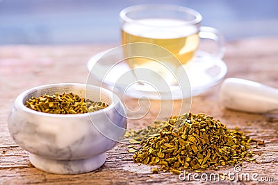 Mistletoe, medicinal herb, dried with mortar and tea cup Stock Photo