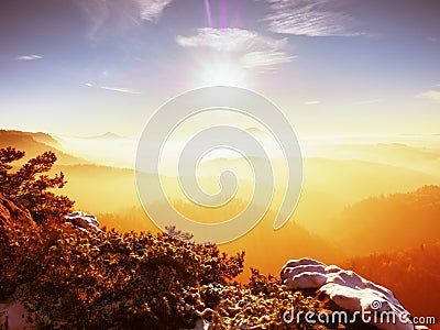 Misty daybreak in a beautiful hills. Gradation of colorful clouds. Stock Photo