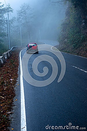 misty fog over empty road in mountains Editorial Stock Photo