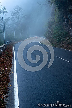 misty fog over empty road in mountains Editorial Stock Photo