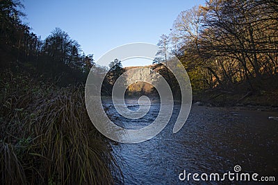 Misty haze over river with rock in background Stock Photo