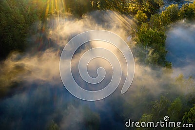 Misty landscape aerial view. Foggy summer morning above river Stock Photo