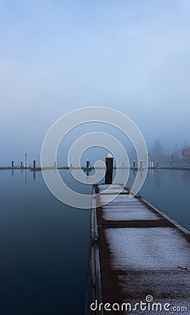 Portrait formatted view of a single boat jetty Stock Photo