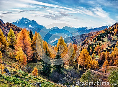 Misty morning view from the top of Giau pass at hte end of October. Impressive autumn scene of Dolomite Alps, Cortina d`Ampezzo l Stock Photo