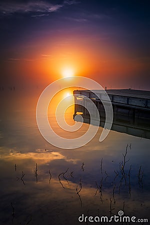 Misty Sunrise over Benbrook Lake Stock Photo