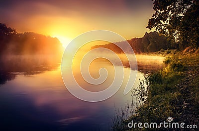 Misty sunrise over the river Stock Photo