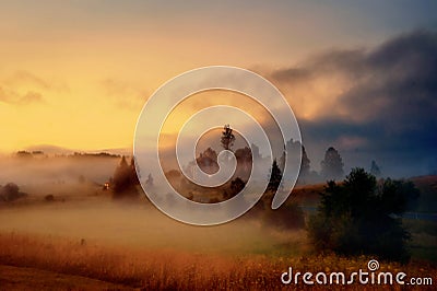 Misty village at dusk Stock Photo