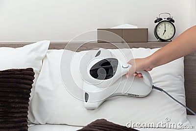 Mite vacuum cleaner using cleaning pillow bed mattress Stock Photo